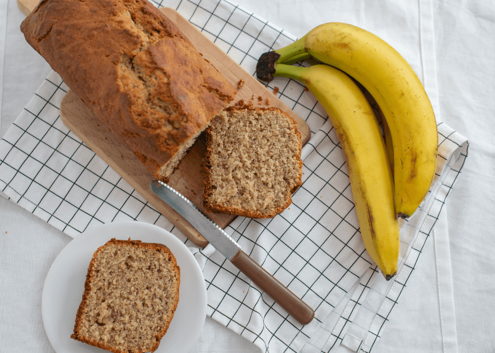 Banana cornflake bread being sliced and plated