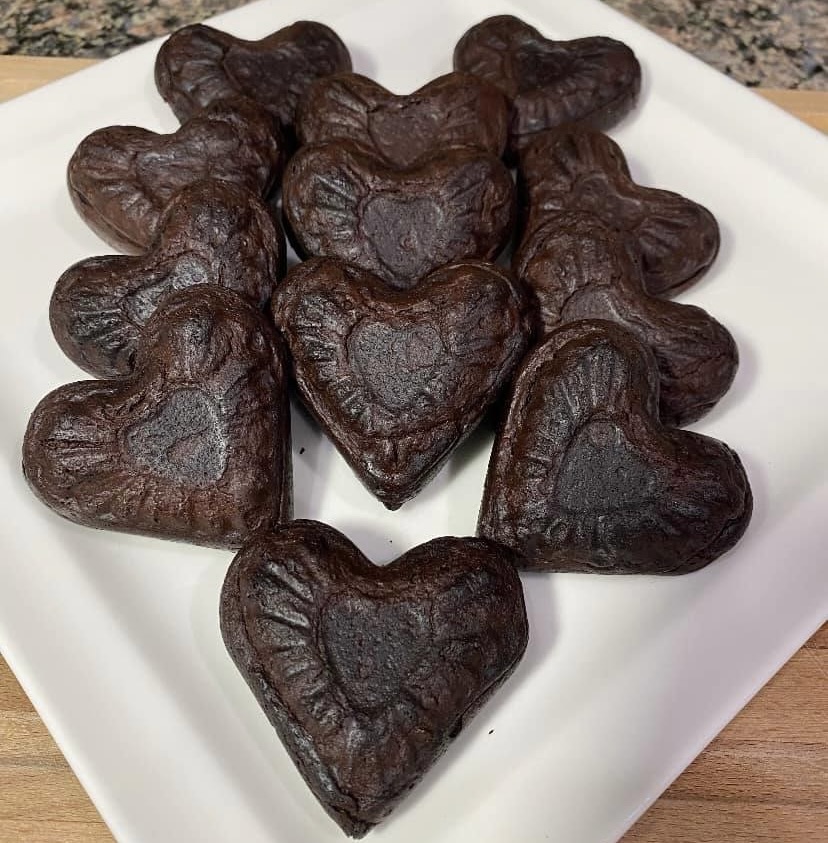 Heart-shaped brownies on a white plate