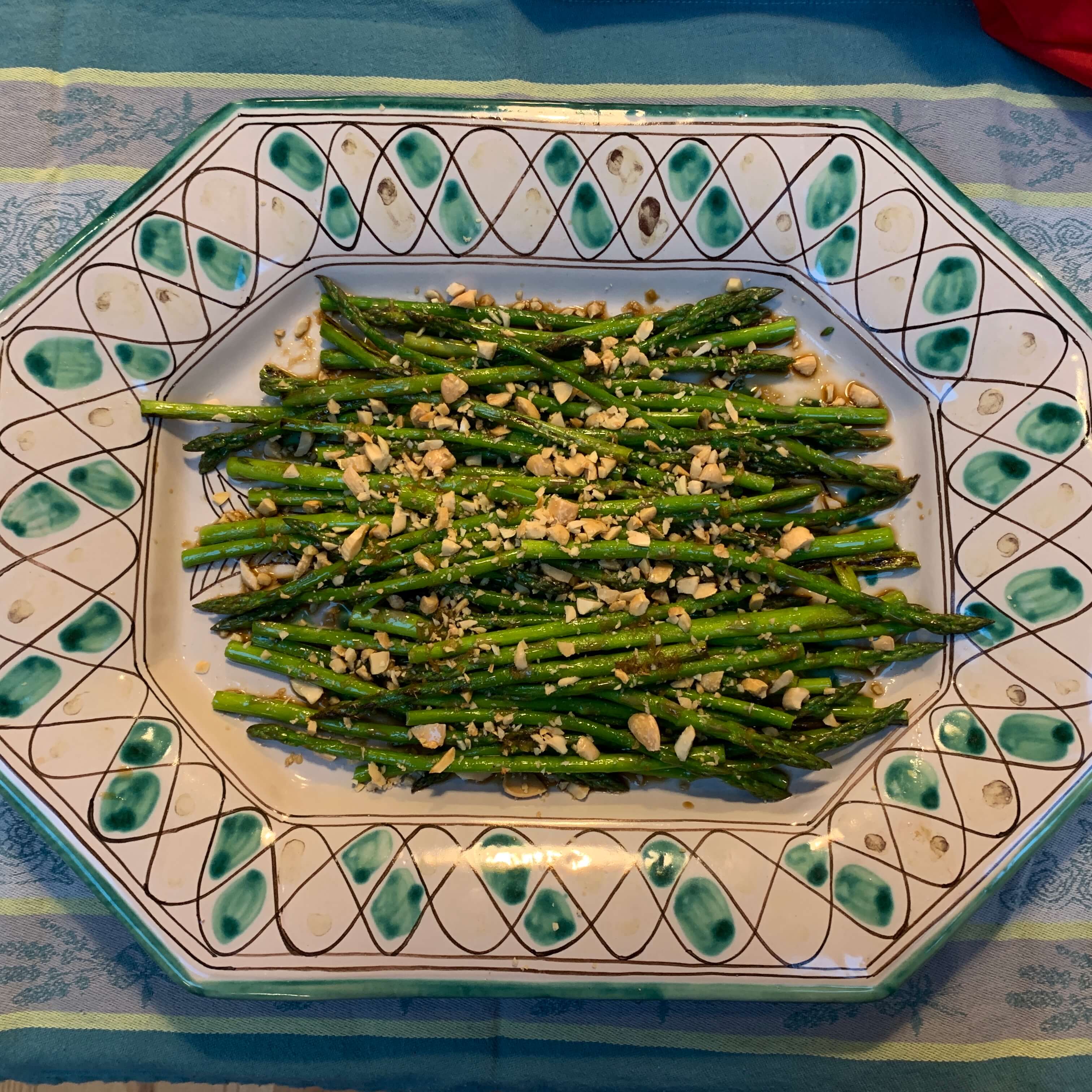 Plated asparagus topped with slivered almonds