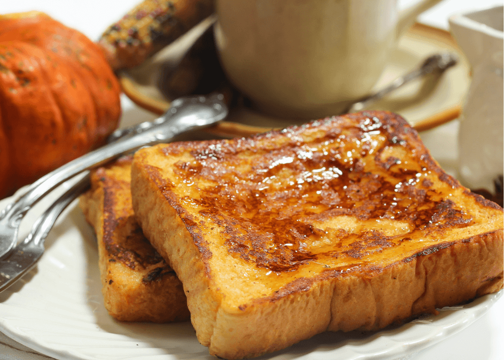 Pumpkin french toast with maple syrup drizzled on top