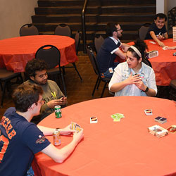 Participants enjoying their favorite games while indulging in snacks and drinks.