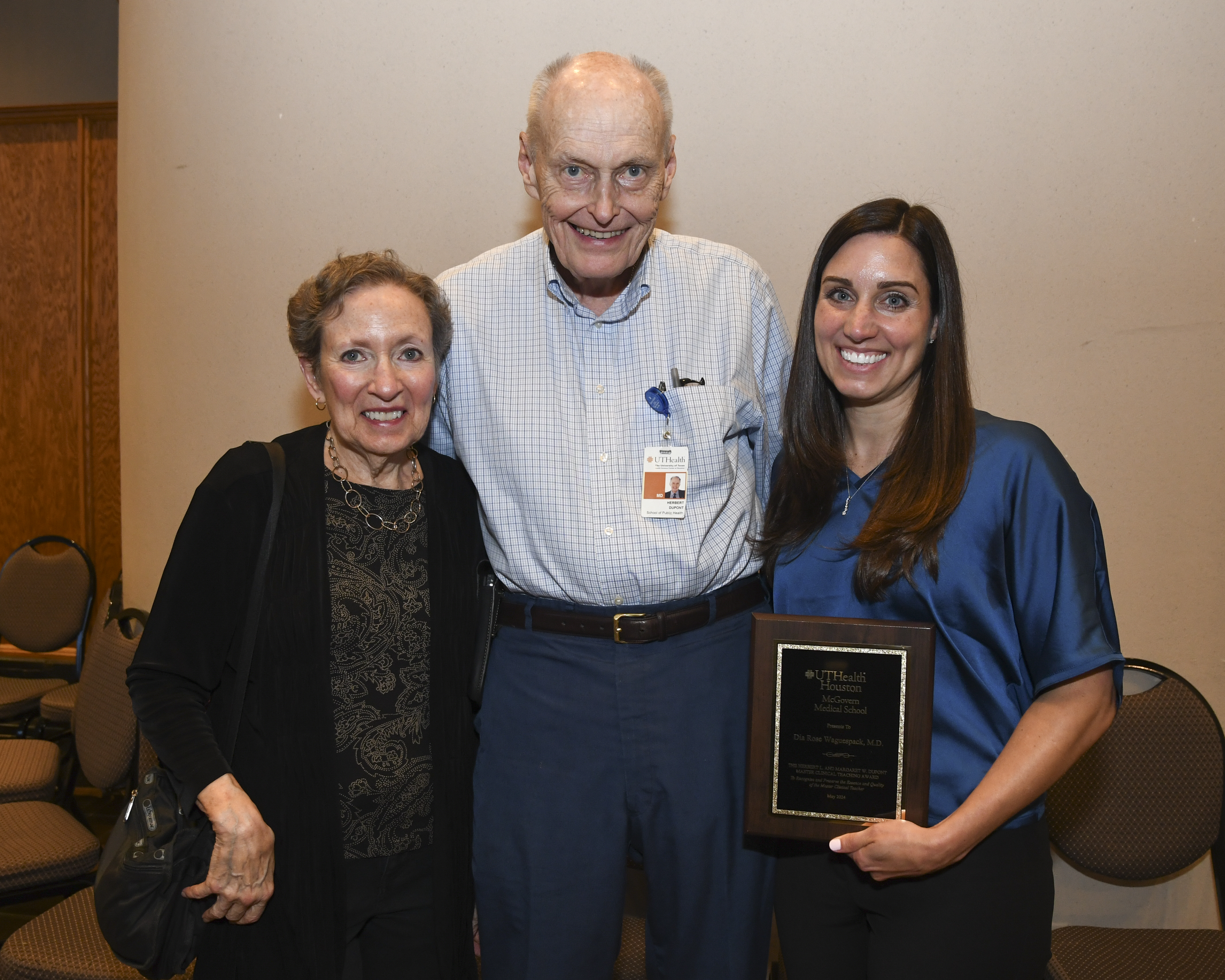 Dia Waguespack, MD, winner of the 2024 Herbert L. and Margaret W. DuPont Master Clinical Teaching Award poses with the DuPonts after receiving the award.