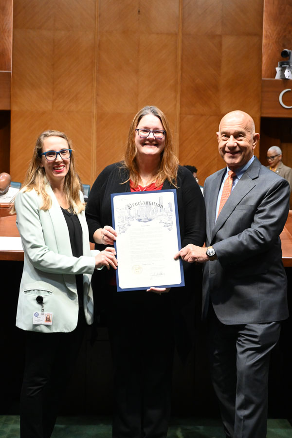 Dr. Sandy McKay receives a Proclamation from Houston city council member Abbie Kamin and Mayor John Whitmire