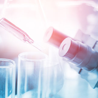 Stock image showing pipette and microscope