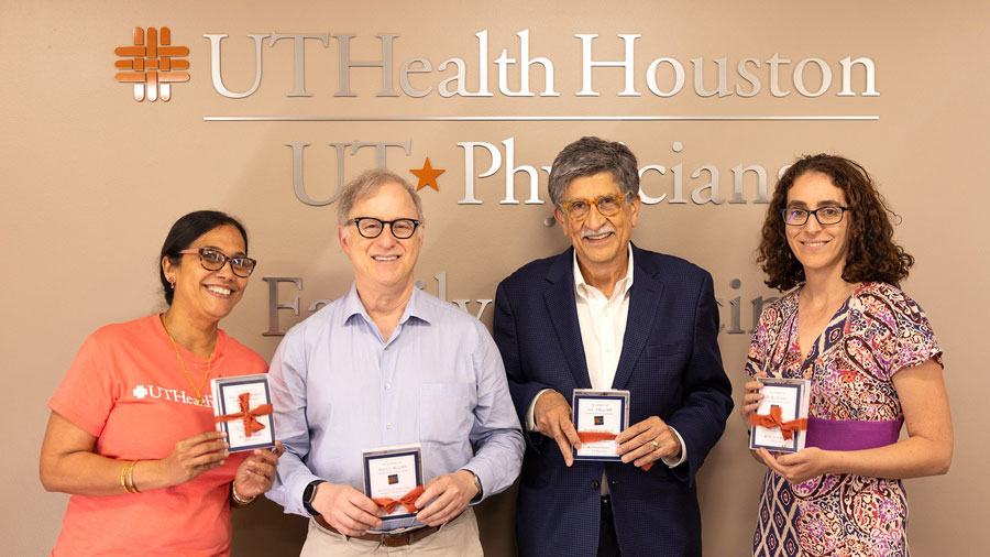 McGovern Doctors posing with their Grateful Patient gifts