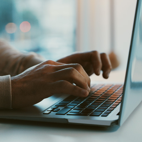 Hands Typing on a keyboard