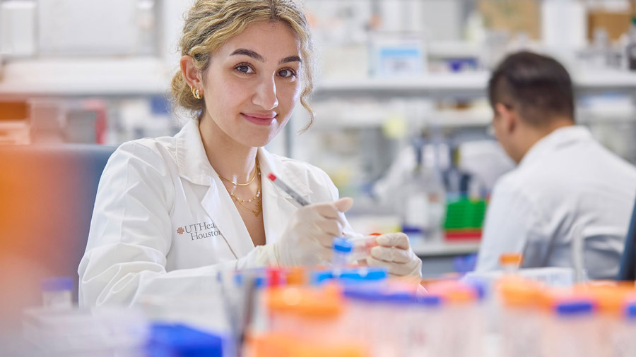 A UTHealth Houston research poses for a photo during an experiment