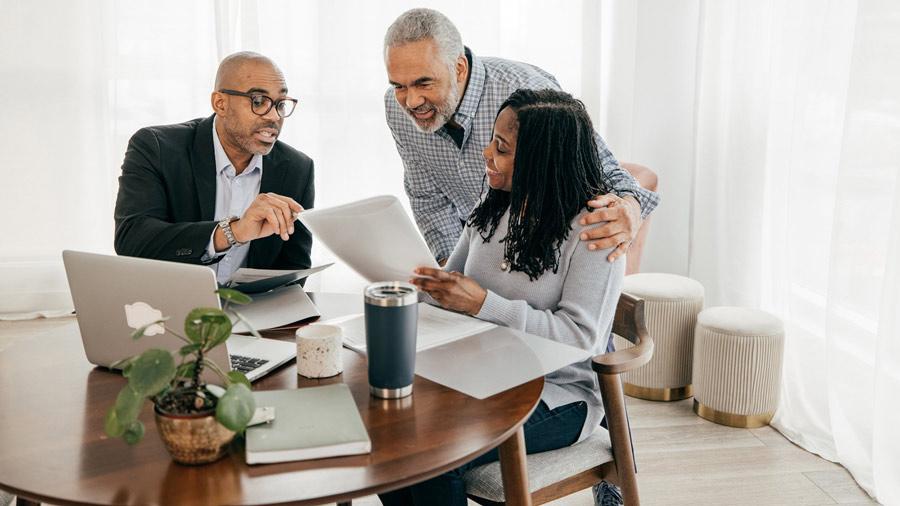 A group of people discussing a financial plan