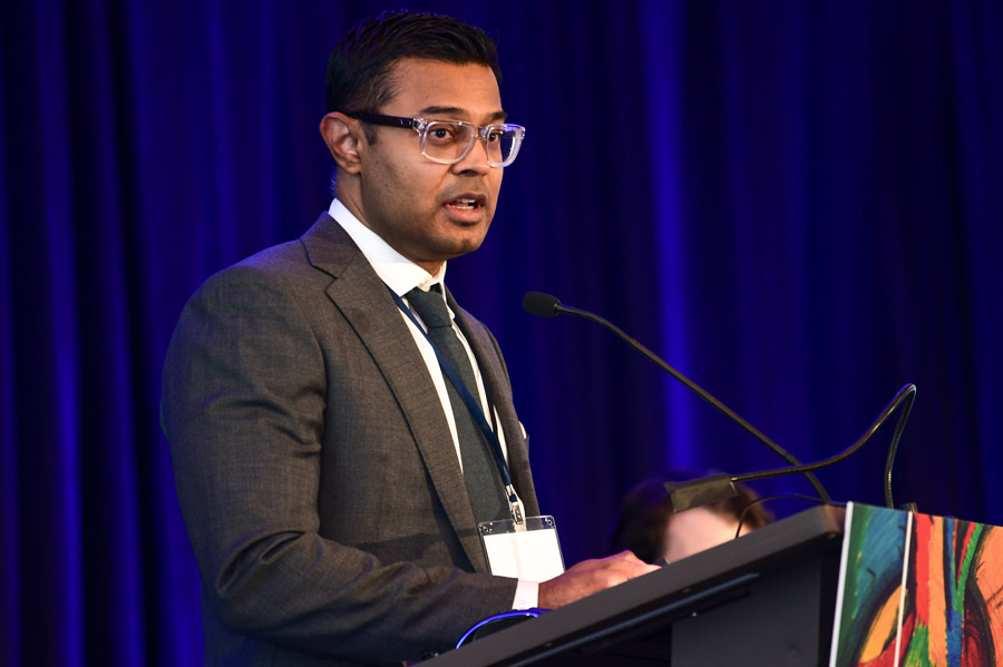 A physician gives a presentation at the aortic symposium