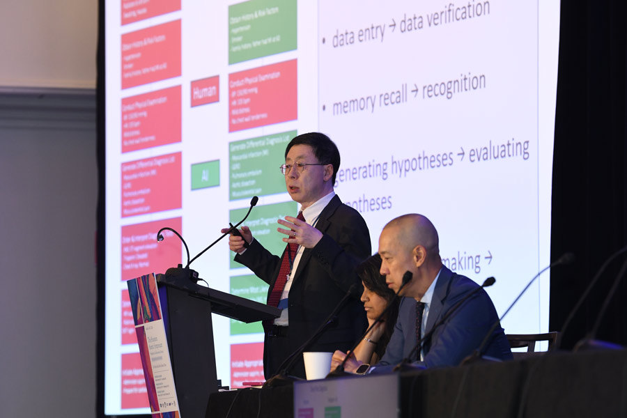 A group of physicians sharing research at the aortic symposium