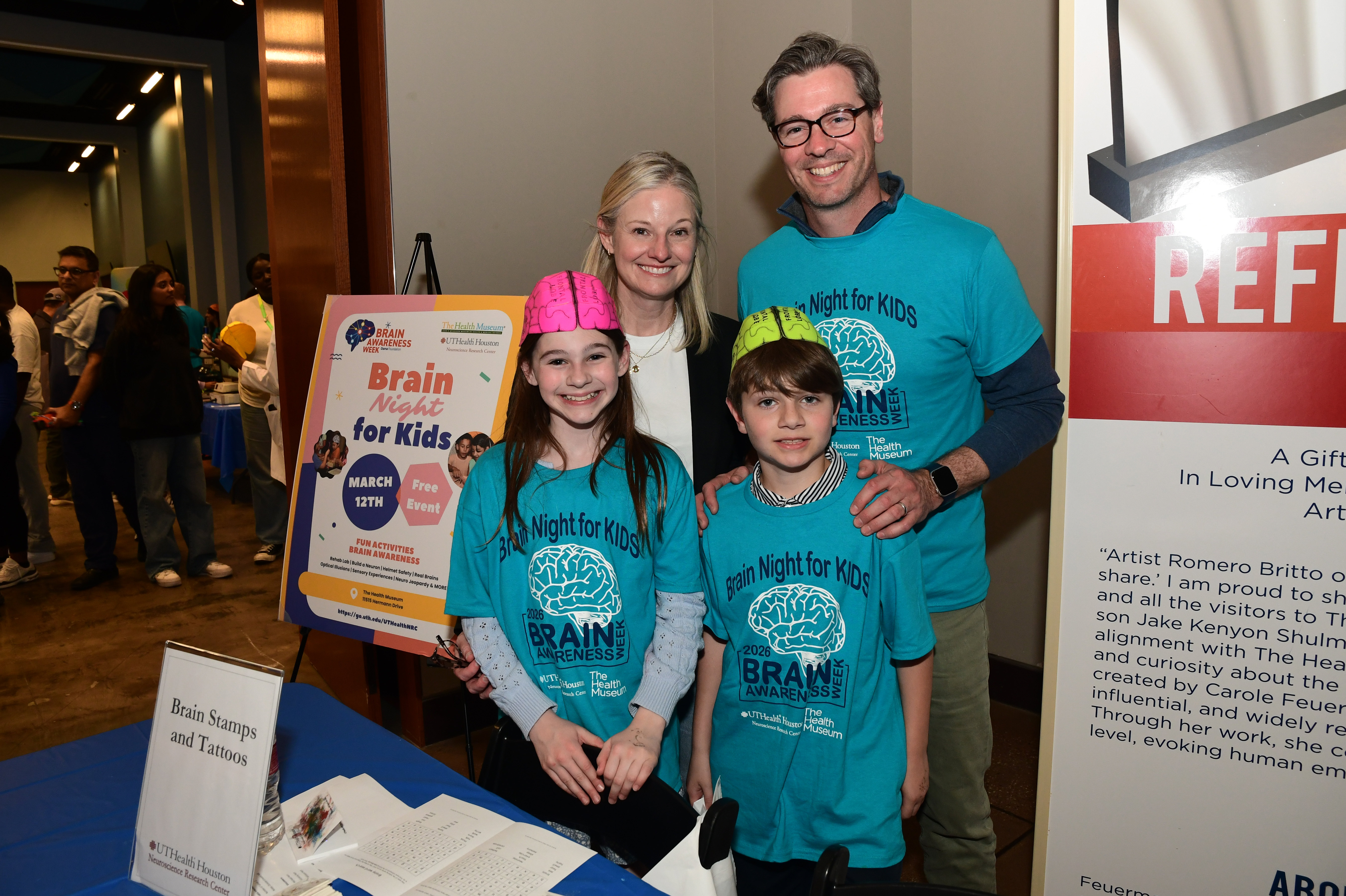 Two adults and two children posing for the camera