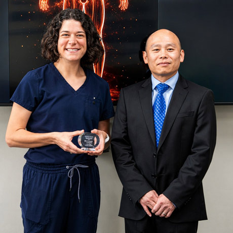 Andrea Abeln receives an award for the top student in Gross Anatomy