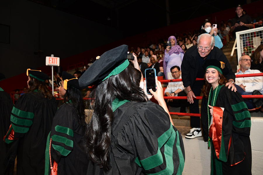 Graduates and family members gather for photos following the McGovern Medical School Class of 2026 Commencement Ceremony.