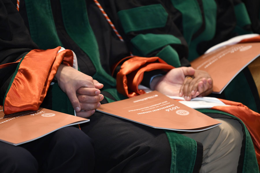 closeup of hands and programs
