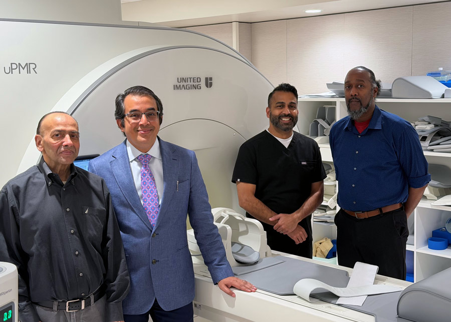 UTHealth Houston team members stand beside the newly launched PET/MRI imaging system, a combined positron emission tomography and magnetic resonance imaging platform designed to support precision cancer care, molecular imaging, and clinical research.