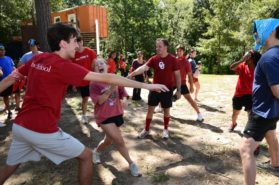 McGovern Medical School students laugh and compete in an outdoor group activity during the Henry W. Strobel Retreat.