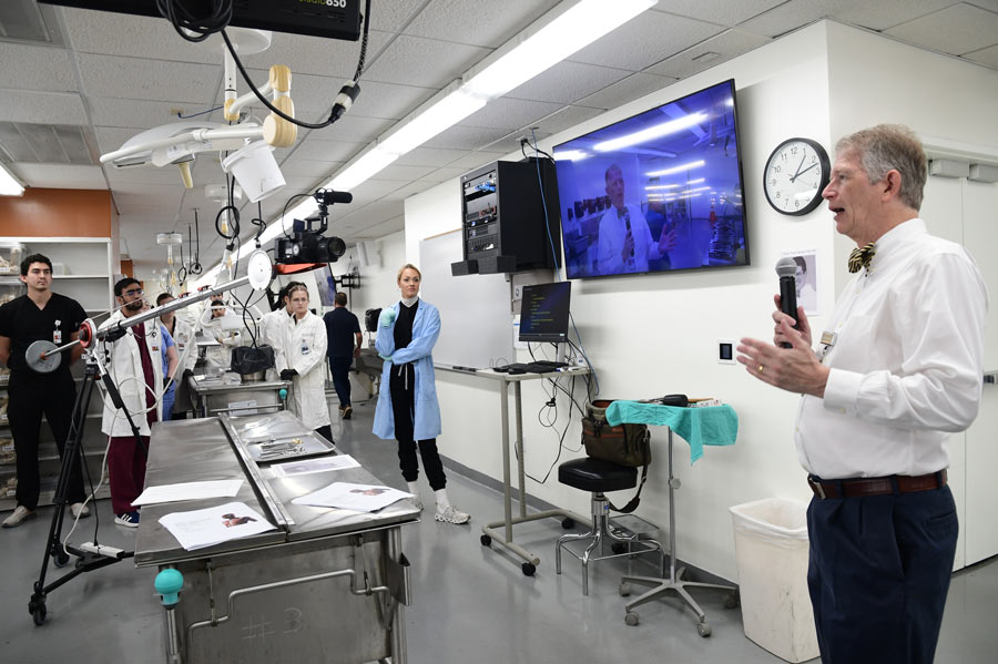 Len Cleary, PhD, addresses first-year medical students gathered in the anatomy lab at McGovern Medical School at UTHealth Houston.