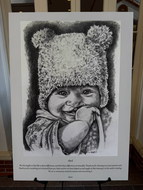 A black-and-white portrait of an infant named Abril, born with a cleft difference, displayed during the 100 Cleft Portraits Tour.