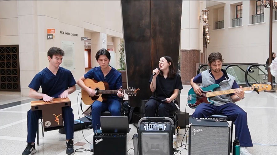 McGovern medical School students playing instruments and singing